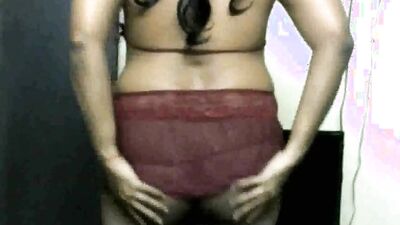 Amateur sissy is posing and flexing in front of the camera