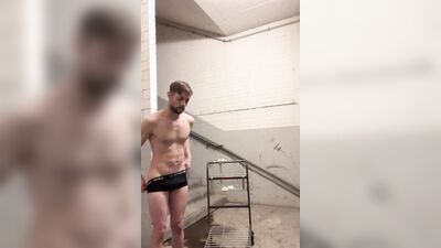 Handsome German bloke is jerking his pecker on a stairs