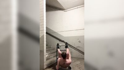 Handsome German bloke is jerking his pecker on a stairs