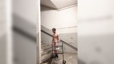 Handsome German bloke is jerking his pecker on a stairs