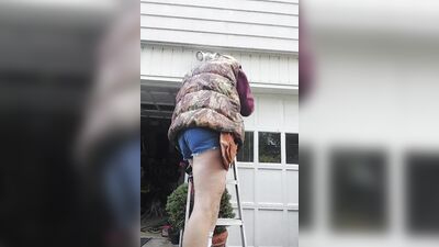 Perverted electrician is playing with his pecker next to the car