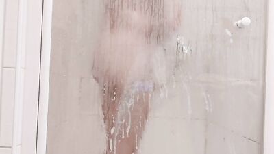Amateur chap is shaving his intimate zone inside the shower