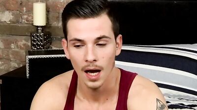 Horny tattooed bloke is jerking his piston in front of the camera