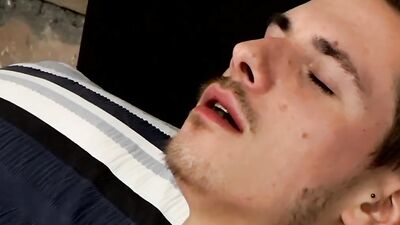 Horny tattooed bloke is jerking his piston in front of the camera