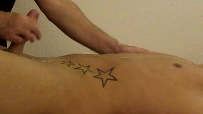 Cute chap gets a massage by his bud and some cock stroking