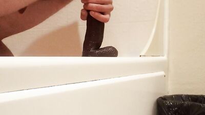Amateur gay teen is playing with his gummy toy inside the bathroom