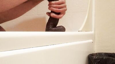 Amateur gay teen is playing with his gummy toy inside the bathroom