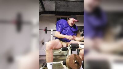 Football practice uniform and coach relaxing after team leaves