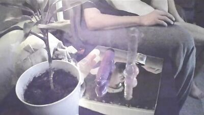 Perverted bloke plays with his hole while smoking a cigarette