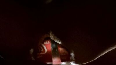 Close-up video of a bloke shoving coca cola bottle into his ass