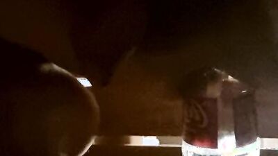 Close-up video of a bloke shoving coca cola bottle into his ass