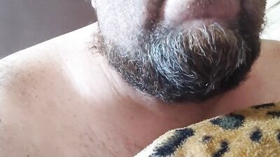 Perverted bearded chap is having fun in front of the camera
