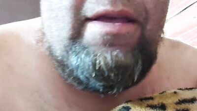 Perverted bearded chap is having fun in front of the camera
