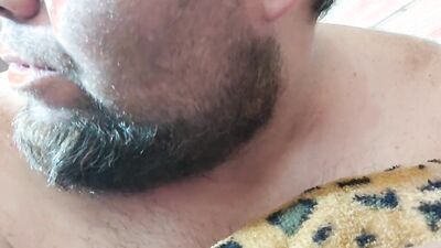 Perverted bearded chap is having fun in front of the camera