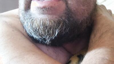 Perverted bearded chap is having fun in front of the camera