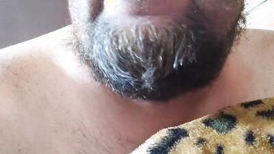 Perverted bearded chap is having fun in front of the camera