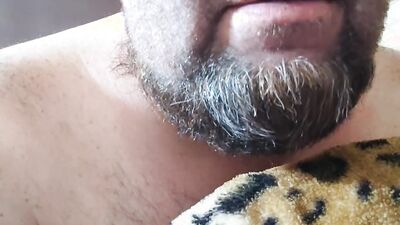 Perverted bearded chap is having fun in front of the camera