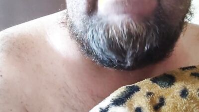 Perverted bearded chap is having fun in front of the camera