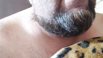 Perverted bearded chap is having fun in front of the camera