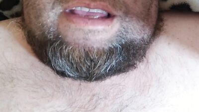 Bearded fellow is having fun in this close-up video