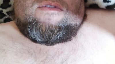 Bearded fellow is having fun in this close-up video