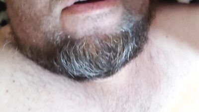 Bearded fellow is having fun in this close-up video