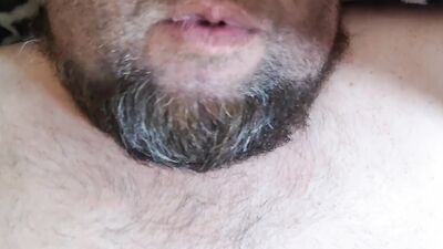 Bearded fellow is having fun in this close-up video