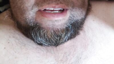Bearded fellow is having fun in this close-up video