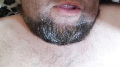 Bearded fellow is having fun in this close-up video