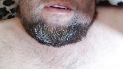 Bearded fellow is having fun in this close-up video