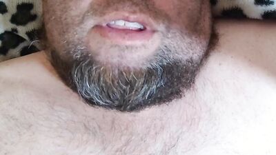 Bearded fellow is having fun in this close-up video