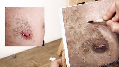 Armando Cabba is painting a nipple in this amateur footage