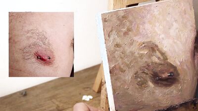 Armando Cabba is painting a nipple in this amateur footage