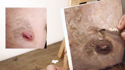 Armando Cabba is painting a nipple in this amateur footage