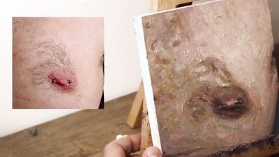 Armando Cabba is painting a nipple in this amateur footage
