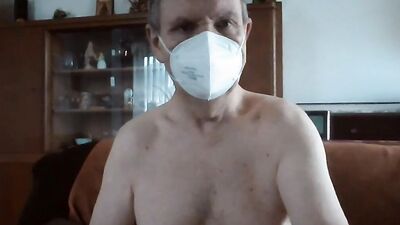 Masked stepdad is playing with his pecker on the couch