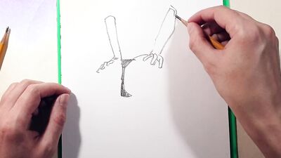 Close-up footage of a chap paining some ass cheeks