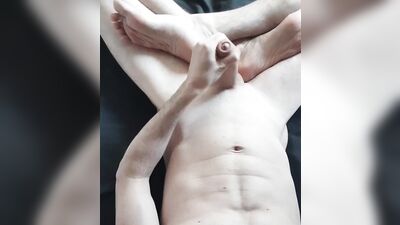 Muscular guy jerks off and cum over his feet