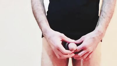 Close-up clip of a dude stroking hisnhard wood
