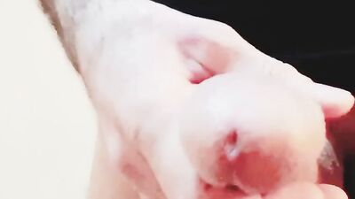 Close-up clip of a dude stroking hisnhard wood