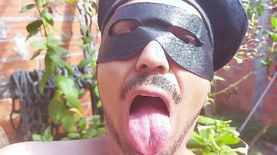 Amateur masked Latino stretches his piston out in a backyard