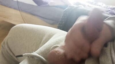 Close-up video of a guy playing with his hard pecker