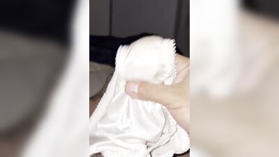 Horny dude is teasing his tiny pecker with a panties