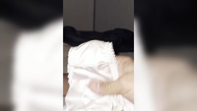 Horny dude is teasing his tiny pecker with a panties