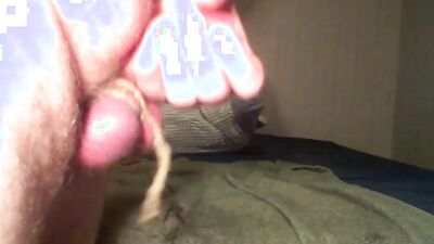 Perverted gay chap is teasing his balls in front of the cam