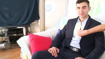 Cute dressed up bloke gets his dick stroked by a roommate