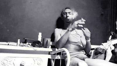 Raba Erre plays with his dick while smoking a cigarette