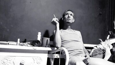 Raba Erre plays with his dick while smoking a cigarette
