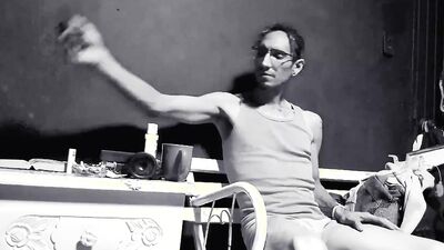Raba Erre plays with his dick while smoking a cigarette