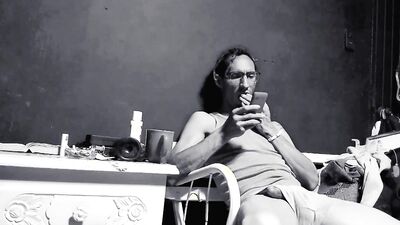 Raba Erre plays with his dick while smoking a cigarette
